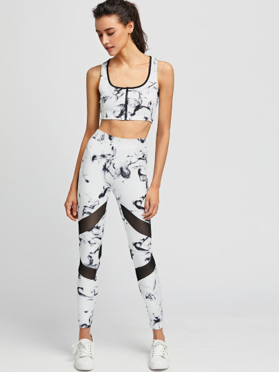 Top corto con estampado tie dye con cremallera en la parte delantera con leggins