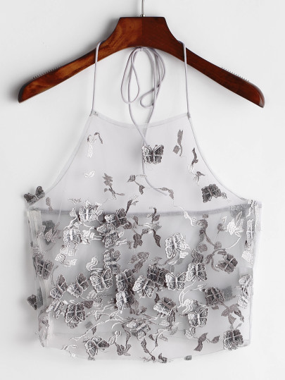 Top de halter con aplicación de mariposa de malla
