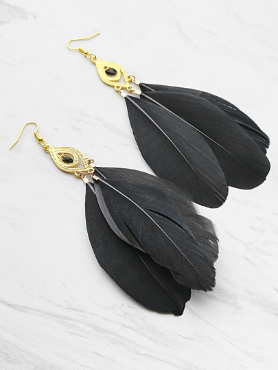 Boucles d'oreilles en plumes embellies