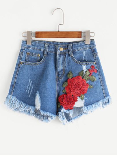Jeans mit Rissen und Applikation