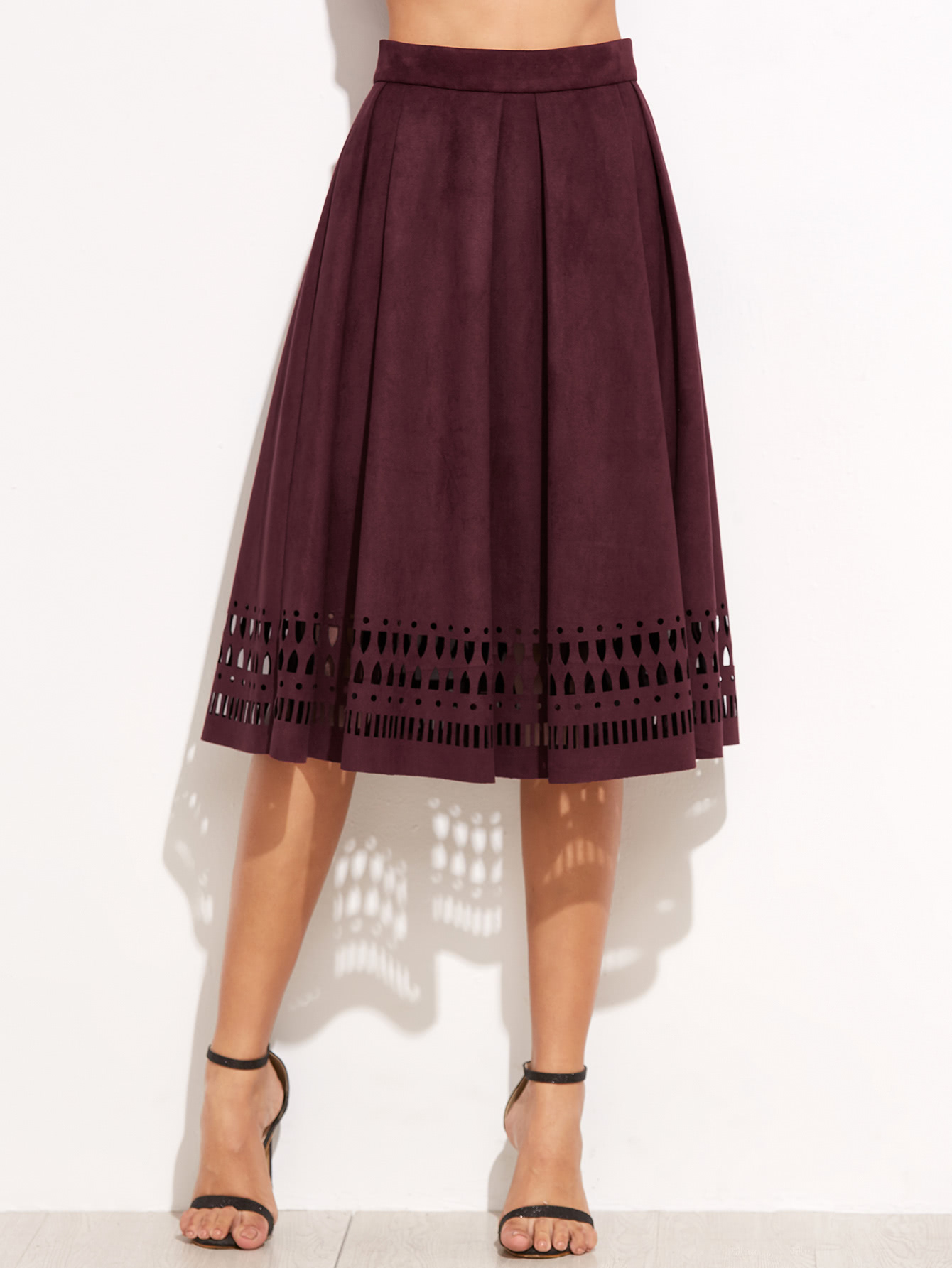 Black Leather Jacket with White Fleece Long Vest & Maroon Silk Skater Skirt Unleash your inner style supernova in Missguided's all new red skirts. Whether you're feelin' the soft and sultry look, or want to cause a little chaos in faux leather, we've got the red skirts you probably need right now. We can't get enough of burgundy and crimson tones and love the wrap over styles.