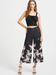 Pantaloni con fondo ampio con stampa di crane, nero